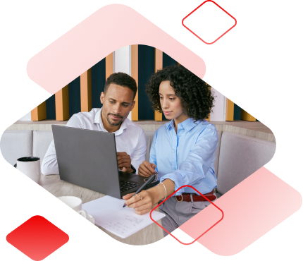 Photo of a man and a woman sitting together, looking at a laptop, and taking notes, surrounded by floating diamond shapes. 